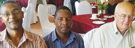 Vivian MacFadyen (r) catching up with acquaintances at the banquet